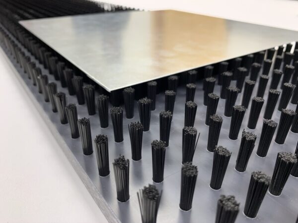 Brush panel for punching table