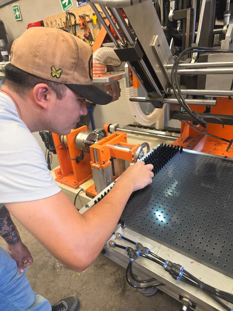 Technician manufacturing an industrial brush at Regios
