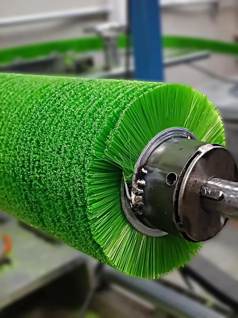Green industrial roller brush used for packaging and product handling