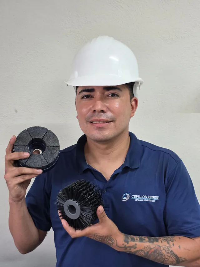 Oscar Rodr&iacute;guez, production supervisor at Regios Brushes, holding a custom strip brush